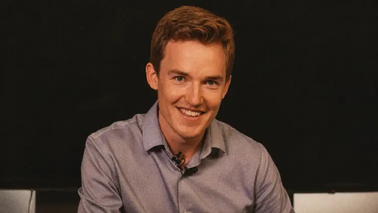 Creator smiling during a desk interview