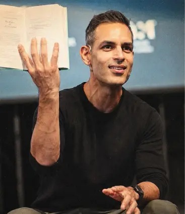 Creator mid-gesture talking to camera