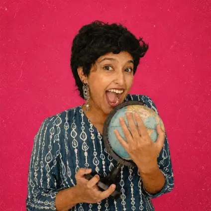 Travel creator holding a globe