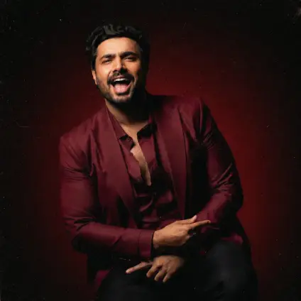 Creator in a maroon suit portrait