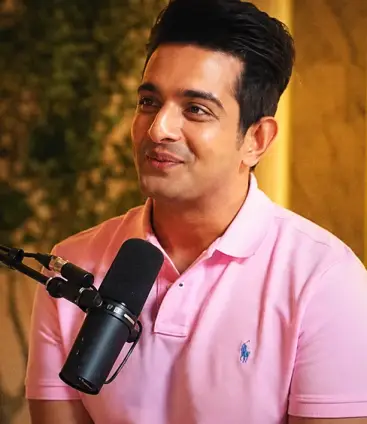 Creator recording a podcast with a studio mic