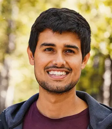 Smiling creator filming a piece to camera